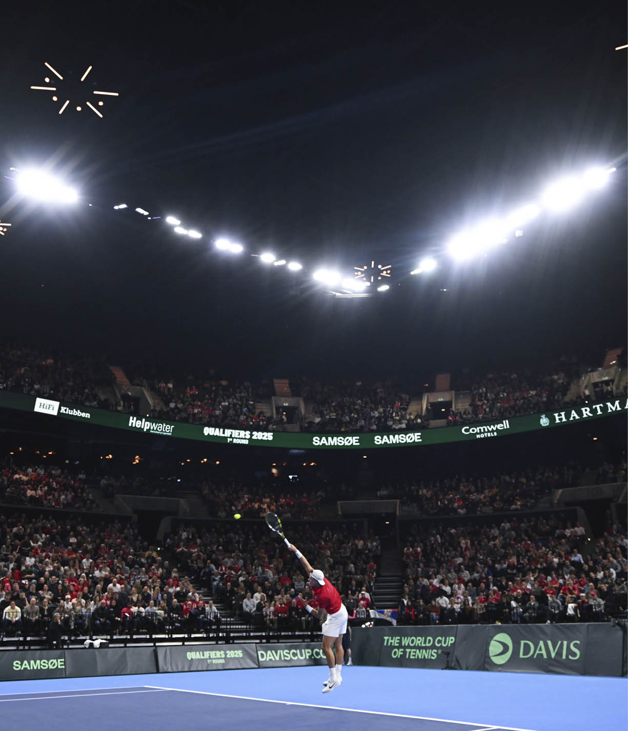 COPENHAGEN, DENMARK - JANUARY 31: Holger Rune of Denmark plays a serve in his single match against Hamad Medjedovic of Serbia during day 1 of the Davis Cup Qualifier first round match between Denmark and Serbia at Royal Arena on January 31, 2025 in Copenhagen, Denmark. (Photo by Oliver Hardt/Getty Images for ITF)